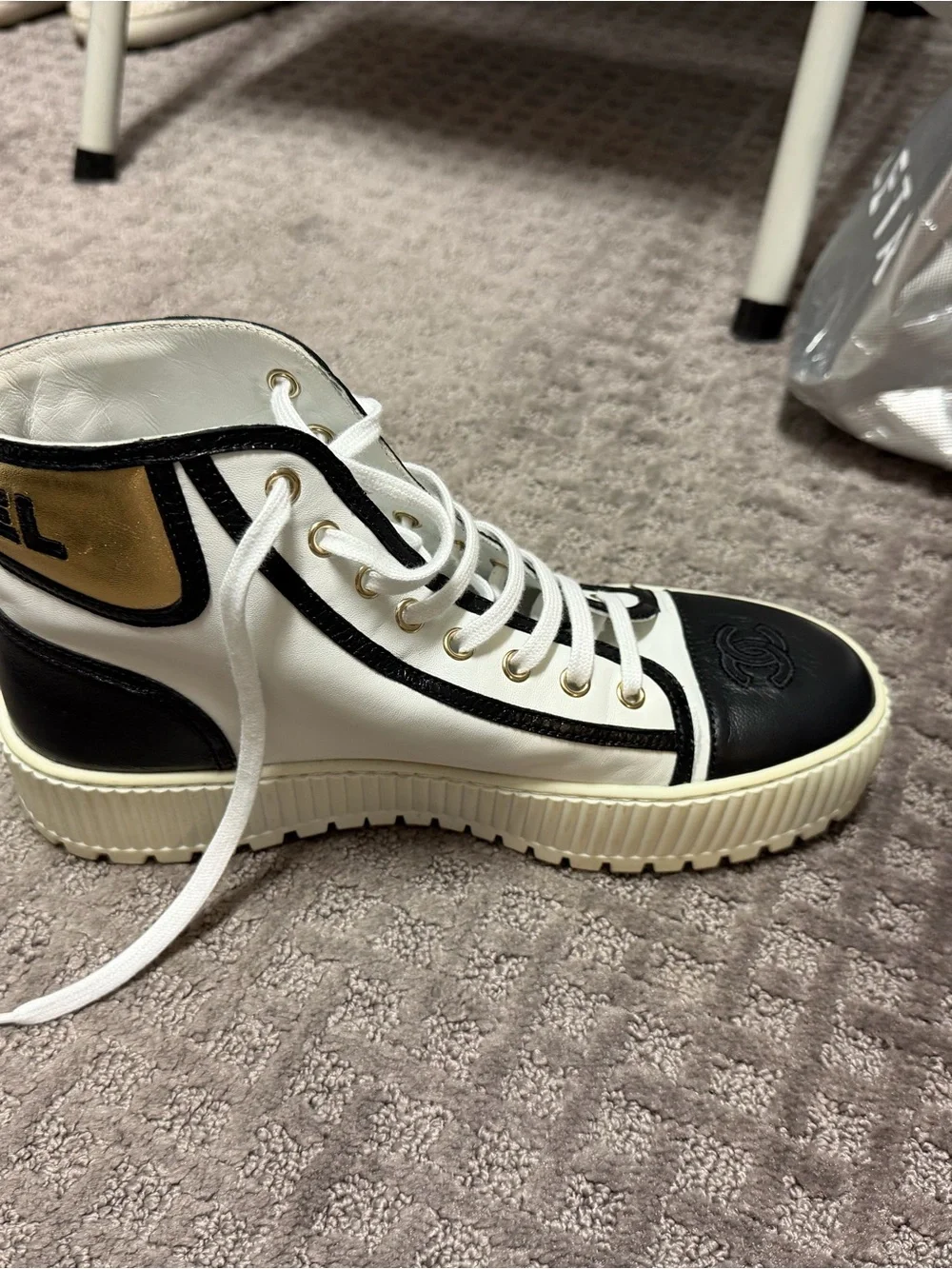 CHANEL White and Black High-Top Logo Sneaker